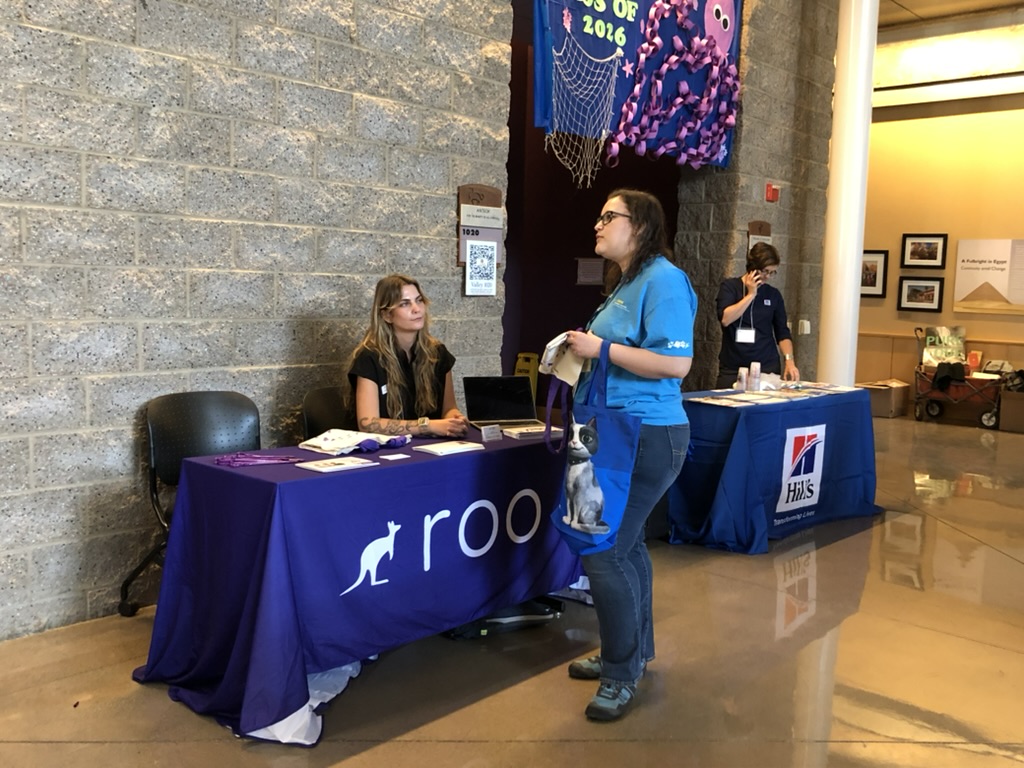 Woman talking to a person in booth