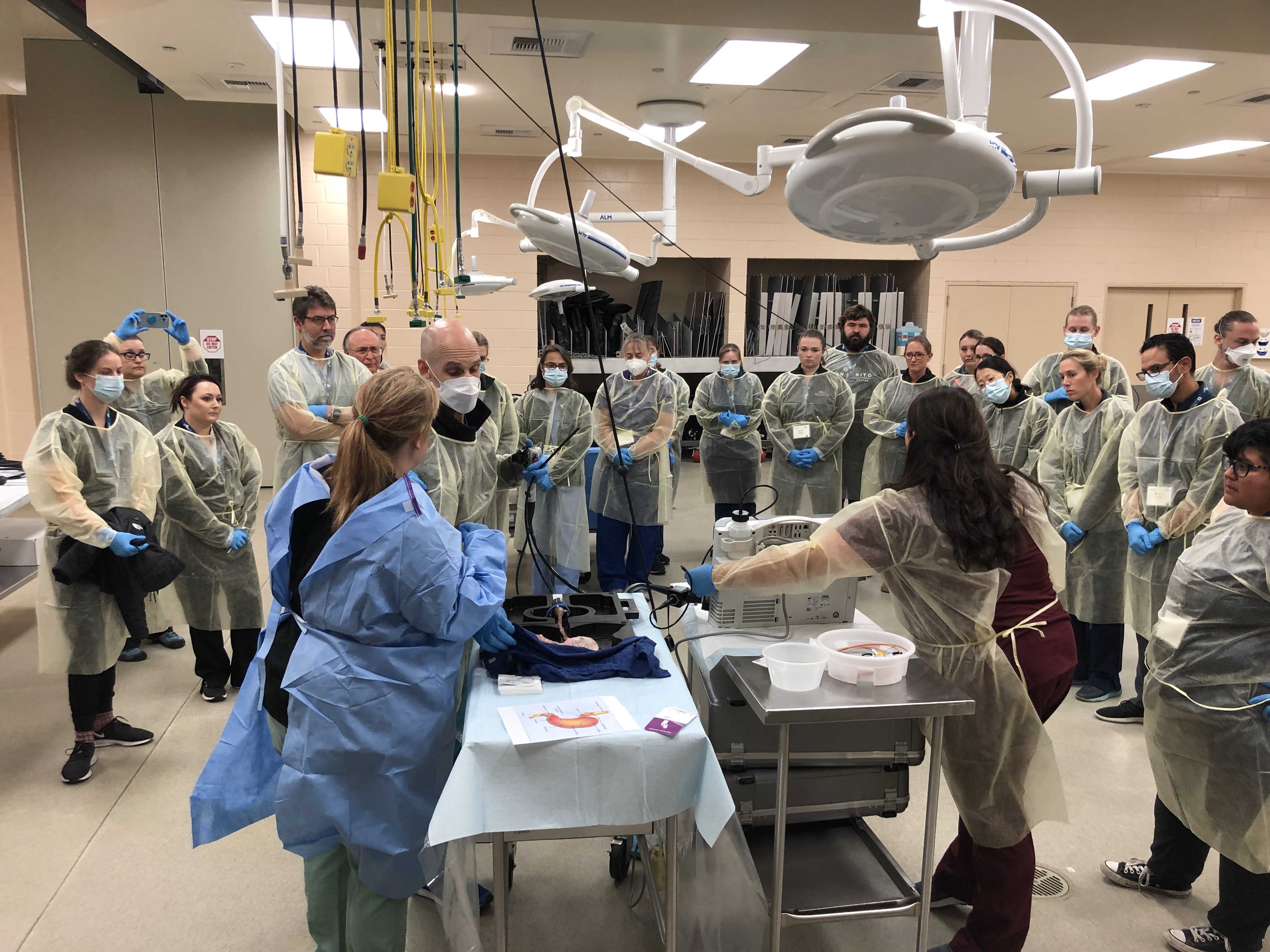 people looking at someone giving a demonstration